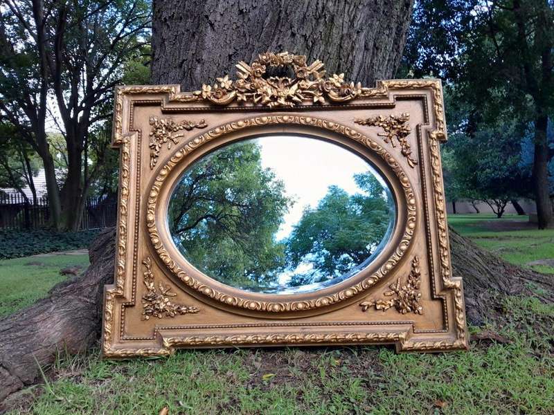 A French Rococo Style Ornately Carved and Gilded Bevelled Mirror 2