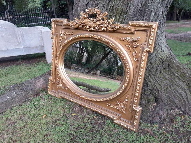 A French Rococo Style Ornately Carved and Gilded Bevelled Mirror 2