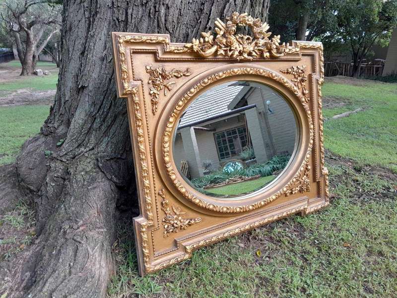 A French Rococo Style Ornately Carved and Gilded Bevelled Mirror 2