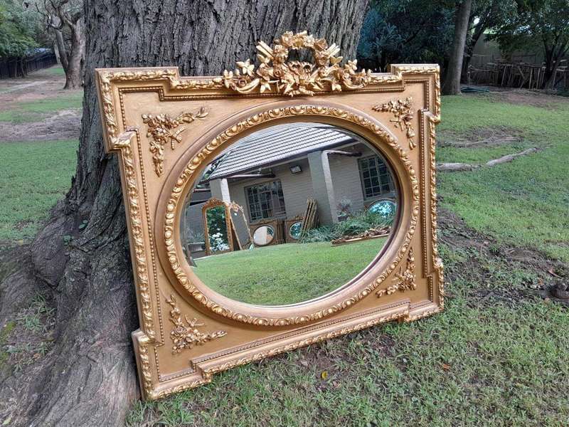 A French Rococo Style Ornately Carved and Gilded Bevelled Mirror 4