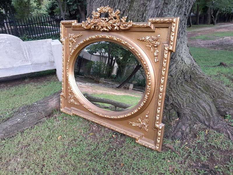 A French Rococo Style Ornately Carved and Gilded Bevelled Mirror 4