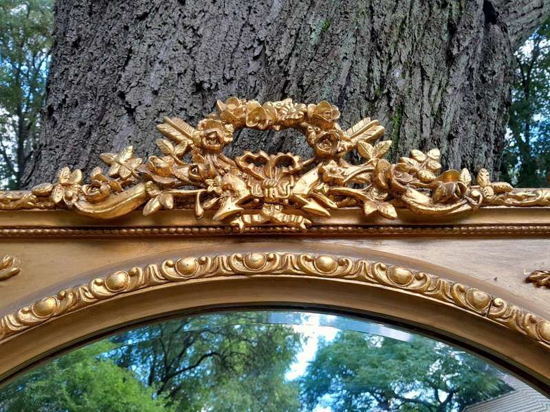 A French Rococo Style Ornately Carved and Gilded Bevelled Mirror 4