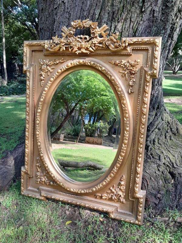 A French Rococo Style Ornately Carved and Gilded Bevelled Mirror 5
