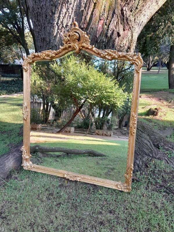 A French Rococo Style Ornately Carved and Gilded Bevelled Mirror 6