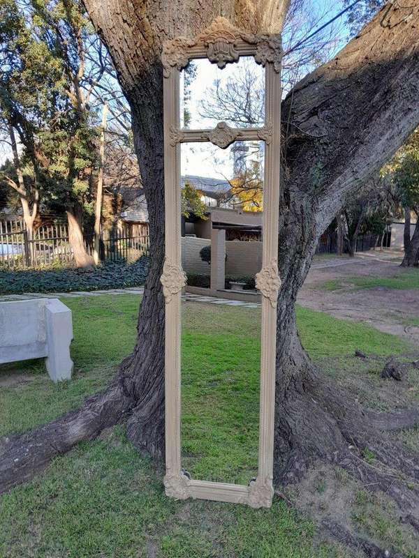 A French Style Ornately Carved And Bevelled Mirror In A Natural  /  Bleached Finish