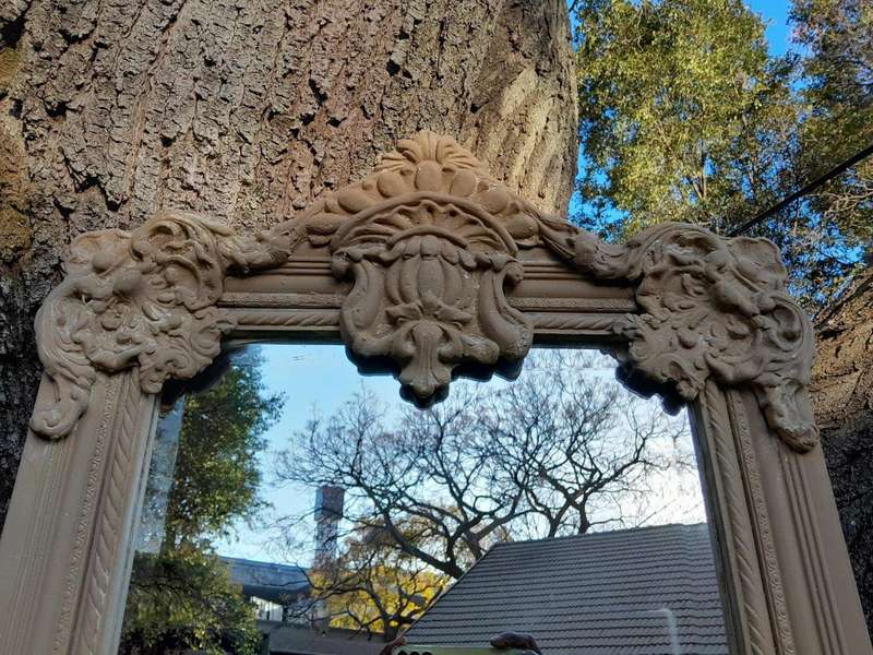A French Style Ornately Carved And Bevelled Mirror In A Natural  /  Bleached Finish