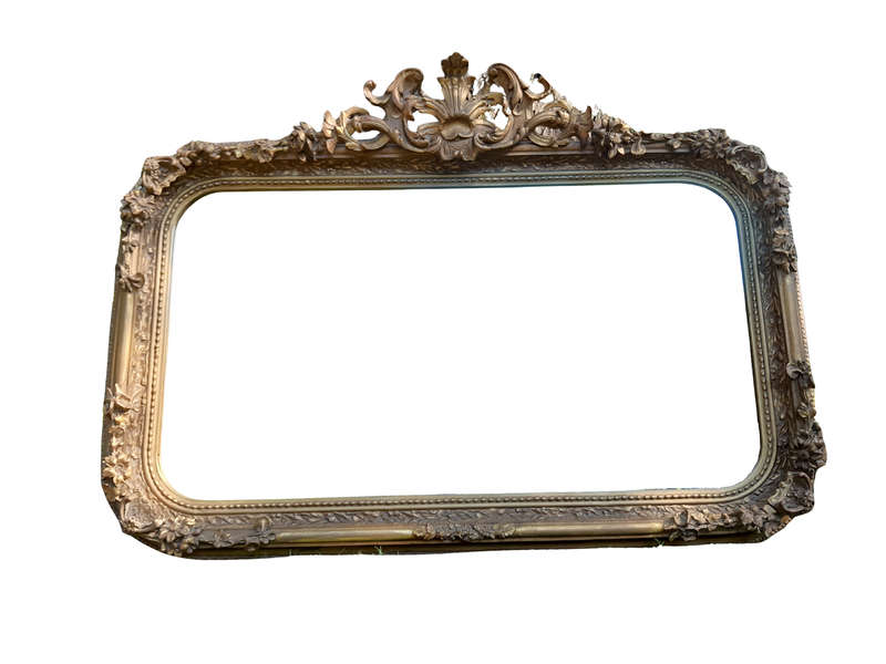 A French Style Ornately Carved and Gilded Bevelled Mirror
