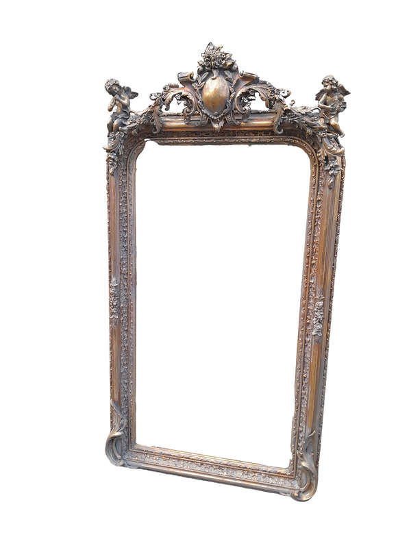 A French Style Ornately Carved and Gilded Bevelled Mirror