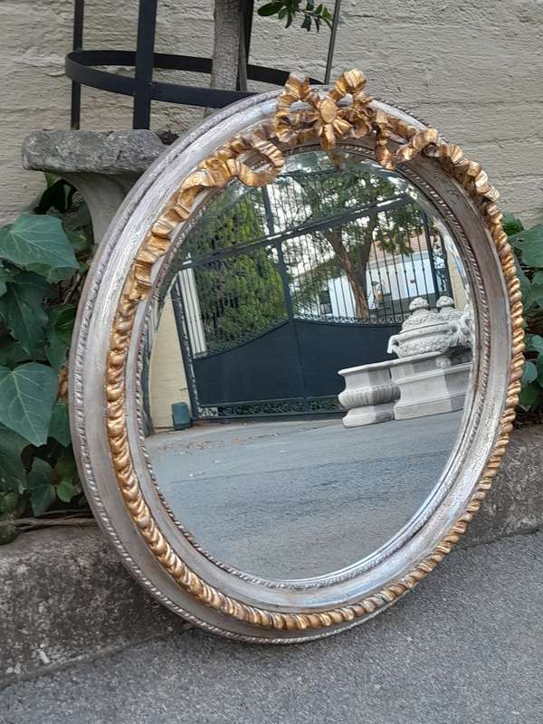 A French Style Carved and Gilded Bevelled Mirror