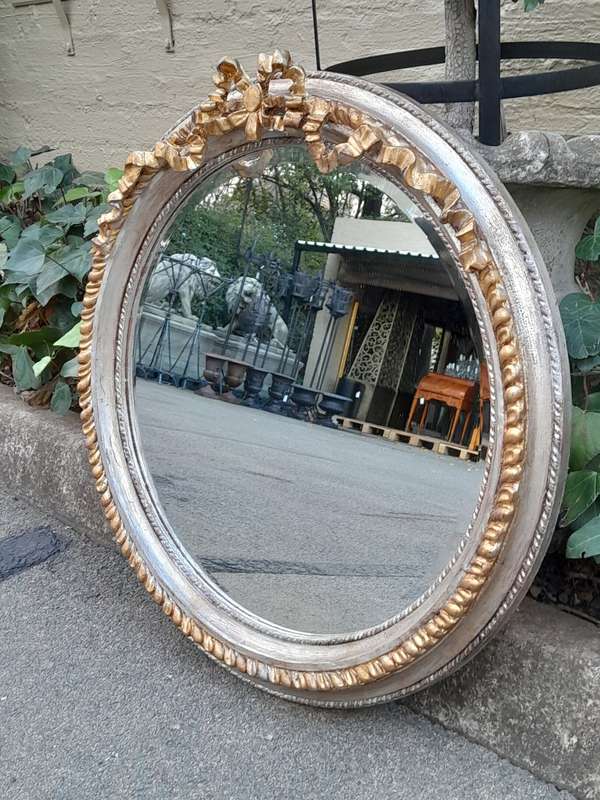 A French Style Carved and Gilded Bevelled Mirror