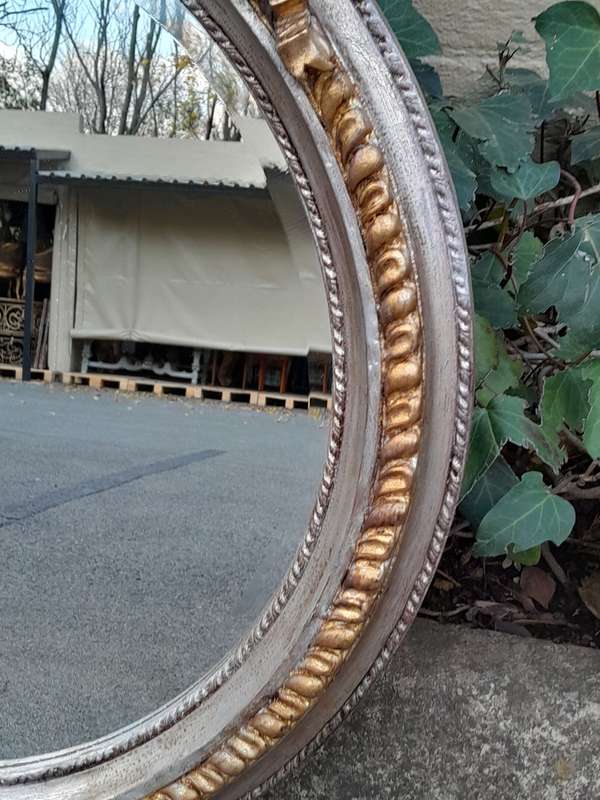 A French Style Carved and Gilded Bevelled Mirror