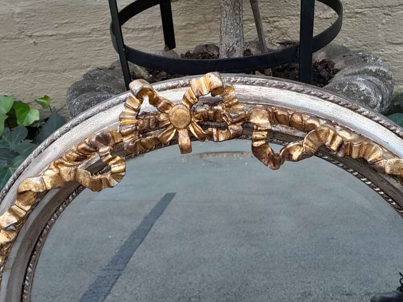 A French Style Carved and Gilded Bevelled Mirror