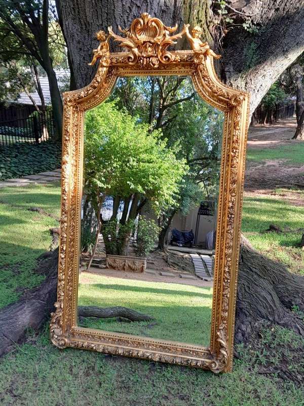 A French Style Ornately Carved and Gilded Bevelled Mirror 9