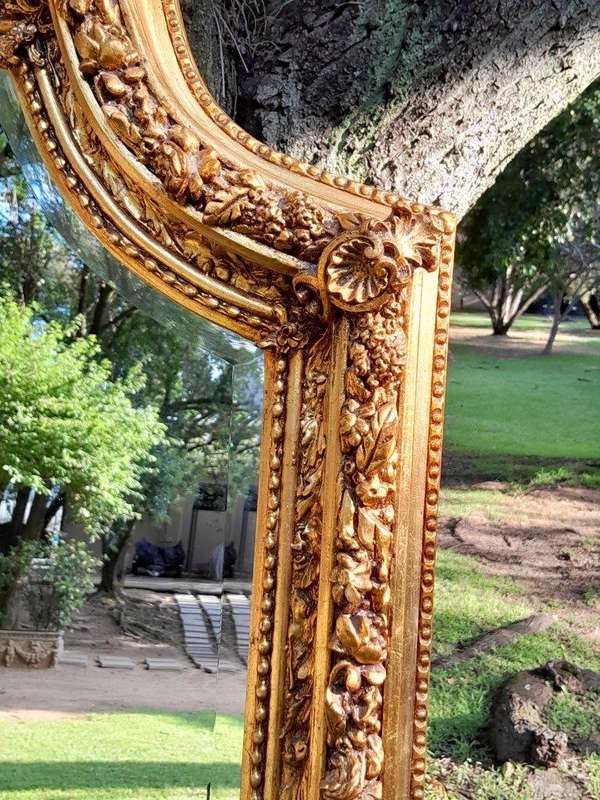 A French Style Ornately Carved and Gilded Bevelled Mirror 9