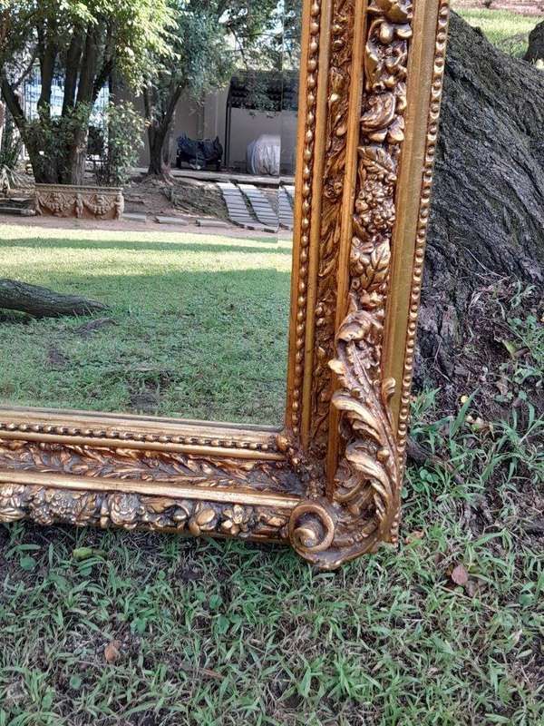A French Style Ornately Carved and Gilded Bevelled Mirror 9