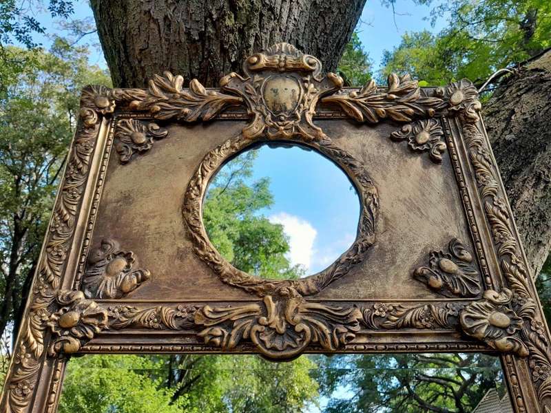 An Ornate Carved Bevelled French Style Mirror