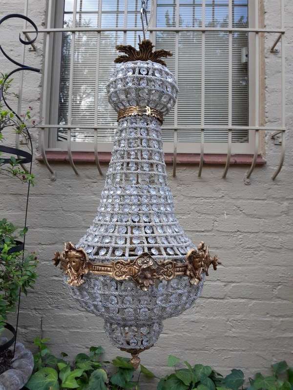 A French Style Pair of Brass Gilt Monumental Empire Chandeliers