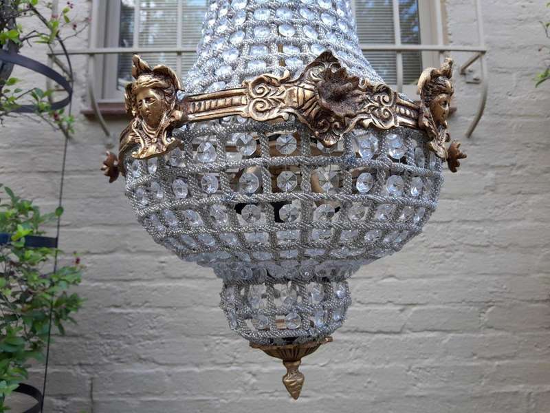 A French Style Pair of Brass Gilt Monumental Empire Chandeliers