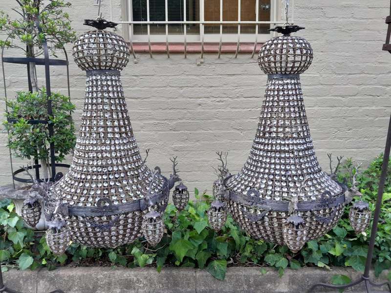 A Large Aged Pair of Monumental Empire French Style Chandeliers with Deer Head Figures