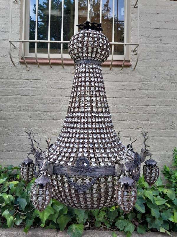 A Large Aged Pair of Monumental Empire French Style Chandeliers with Deer Head Figures