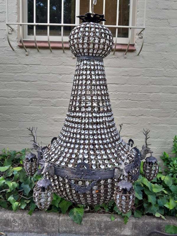 A Large Aged Pair of Monumental Empire French Style Chandeliers with Deer Head Figures