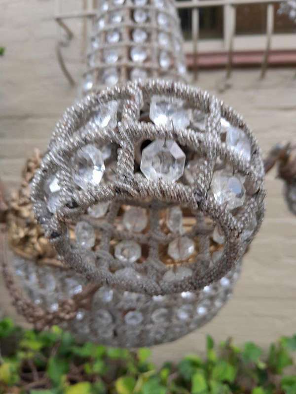 A Large Aged Pair of Monumental Empire French Style Chandeliers with Deer Head Figures
