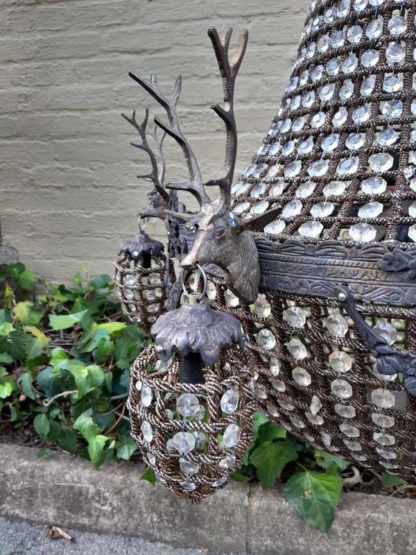 A Large Aged Pair of Monumental Empire French Style Chandeliers with Deer Head Figures