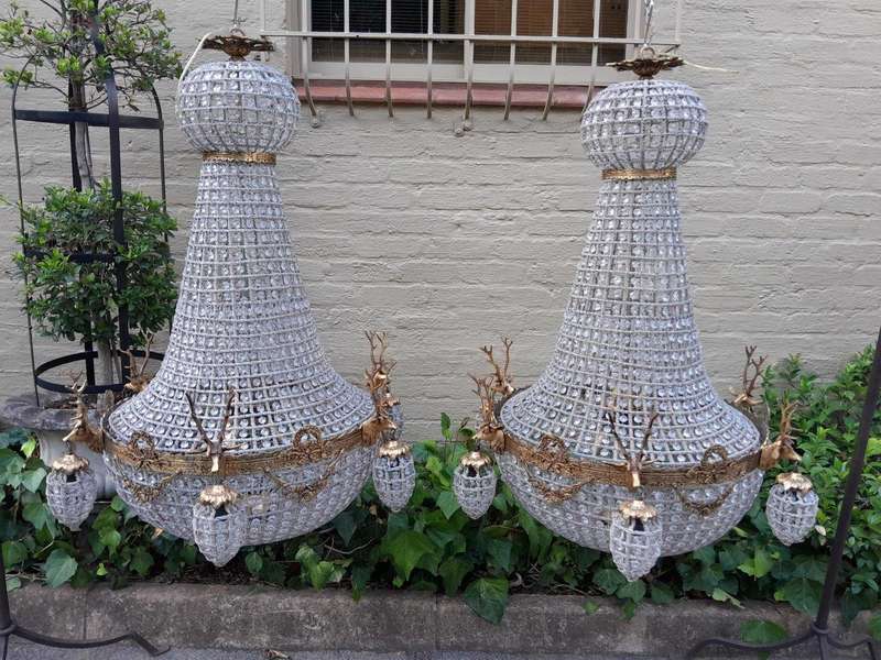 A Large Brass & Aged Pair of Monumental Empire French Style Chandeliers with Deer Head Figures
