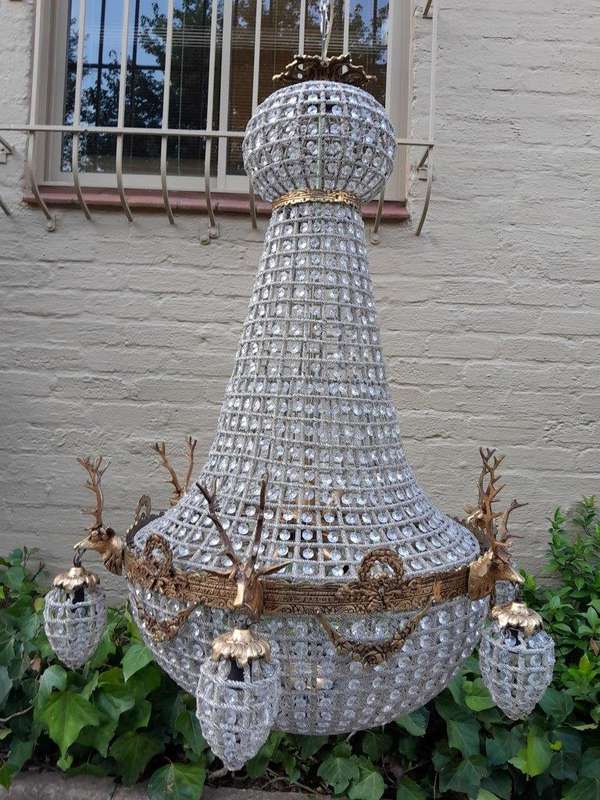 A Large Brass & Aged Pair of Monumental Empire French Style Chandeliers with Deer Head Figures