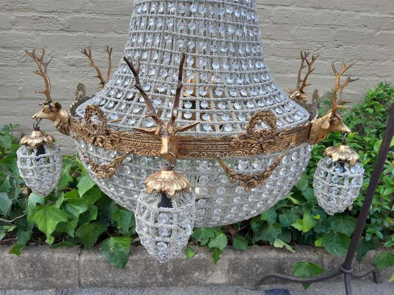 A Large Brass & Aged Pair of Monumental Empire French Style Chandeliers with Deer Head Figures