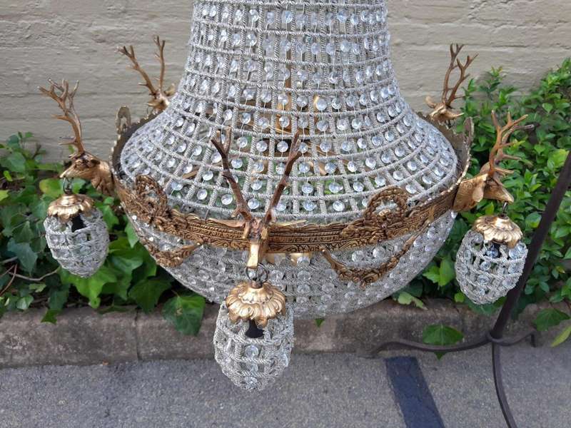 A Large Brass & Aged Pair of Monumental Empire French Style Chandeliers with Deer Head Figures