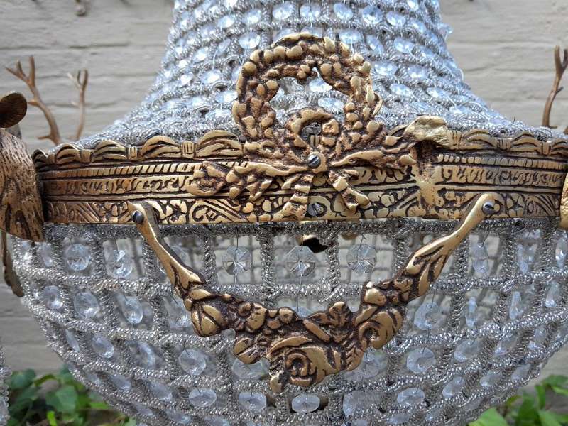 A French Style Pair of Aged Brass Pair of Monumental Empire Style Chandeliers with Deer Head Figures