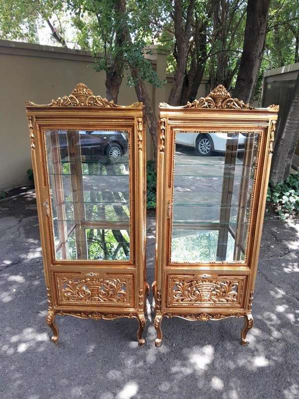 A Pair of French Louis XVI Style Ornately Carved & Gilded Showcases
