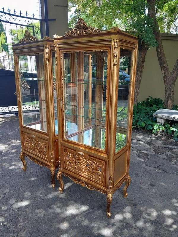 A Pair of French Louis XVI Style Ornately Carved & Gilded Showcases