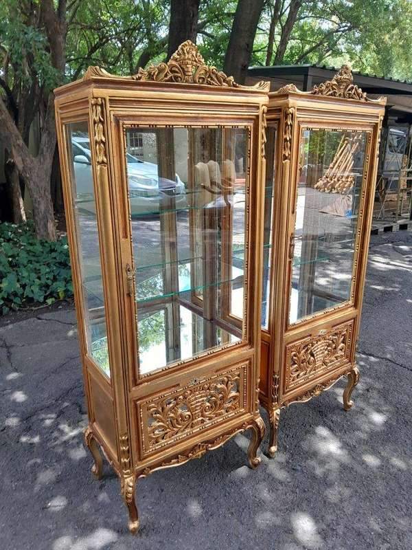 A Pair of French Louis XVI Style Ornately Carved & Gilded Showcases