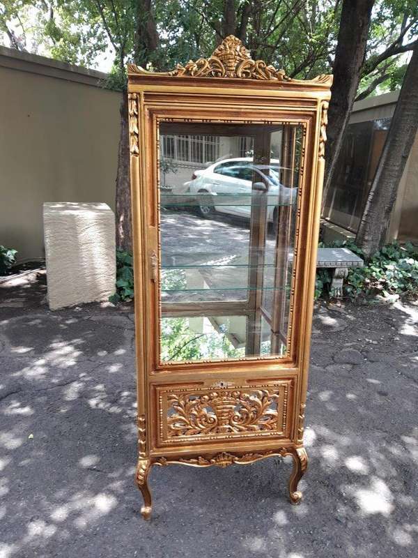 A Pair of French Louis XVI Style Ornately Carved & Gilded Showcases