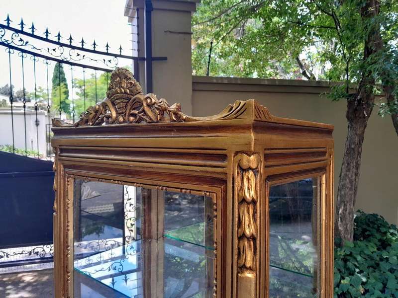 A Pair of French Louis XVI Style Ornately Carved & Gilded Showcases