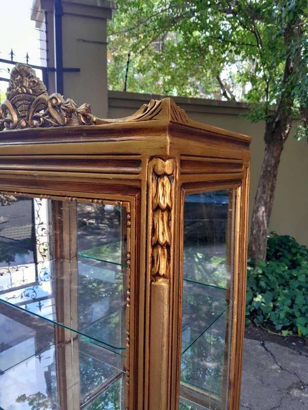 A Pair of French Louis XVI Style Ornately Carved & Gilded Showcases