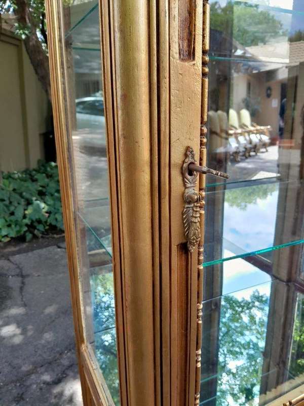 A Pair of French Louis XVI Style Ornately Carved & Gilded Showcases