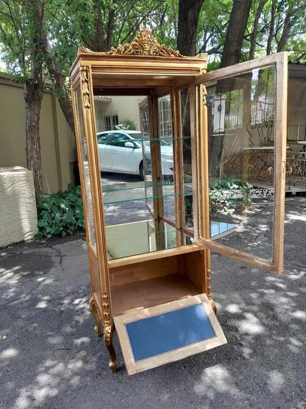 A Pair of French Louis XVI Style Ornately Carved & Gilded Showcases