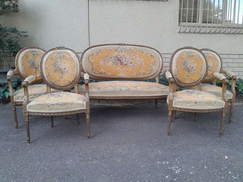 A 19th Century Antique French Giltwood Set Comprising a Settee and Four Medallion Armchairs uphol...