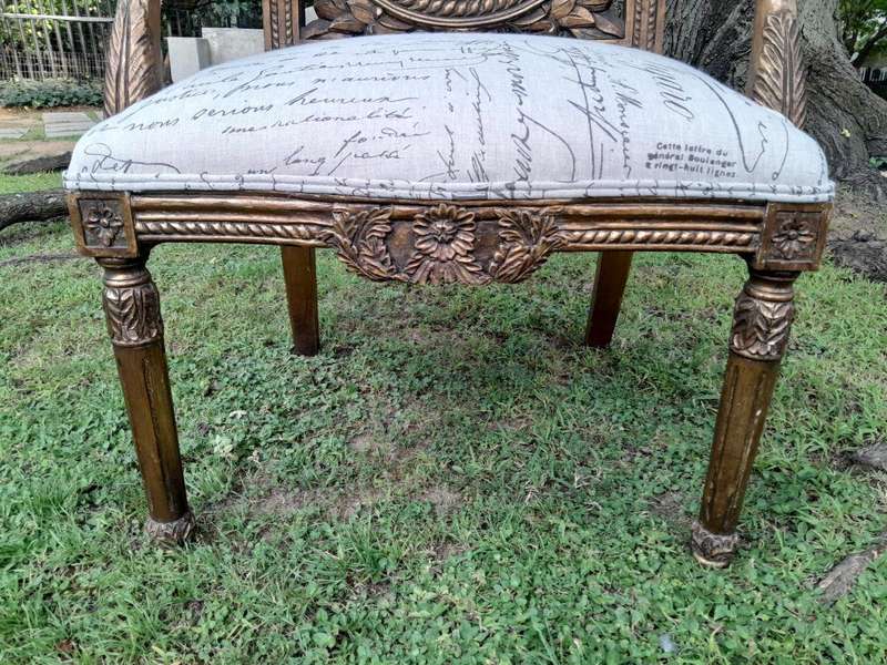 A 20TH Century French Style Pair of Ornately Carved and Gilded Armchairs Upholstered in a Custom-...