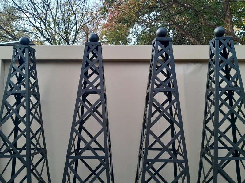 A Handmade Pair Of Wrought Iron Obelisks In A Hand Painted "Aged" Finish