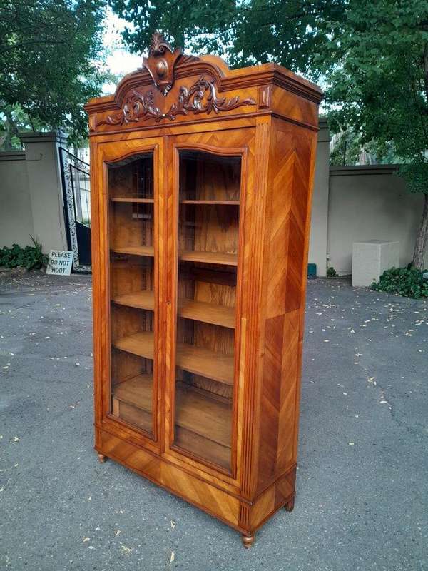 A 19th Century French Rococo Style Bookcase with Bevelled Glass, Shelves and Two Drawers