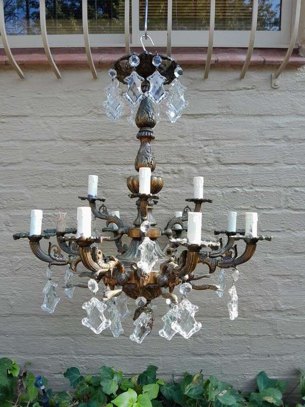 A 20th Century French Style Antique Brass and Crystal Twelve Light Chandelier