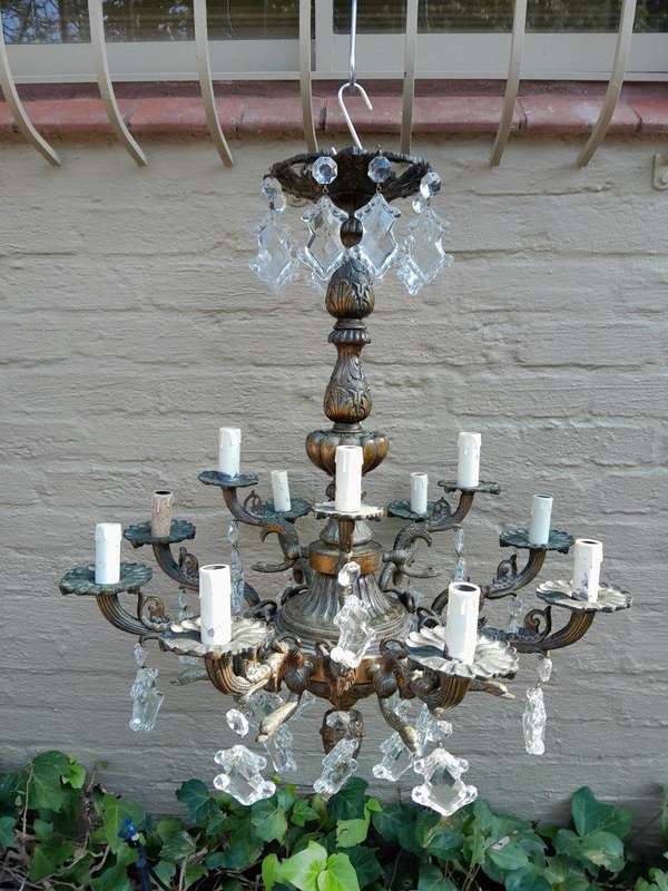 A 20th Century French Style Antique Brass and Crystal Twelve Light Chandelier
