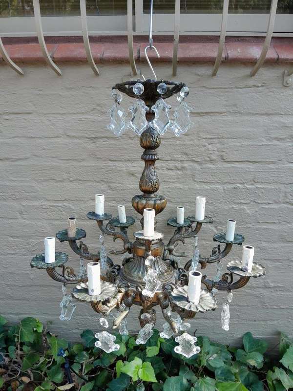 A 20th Century French Style Antique Brass and Crystal Twelve Light Chandelier