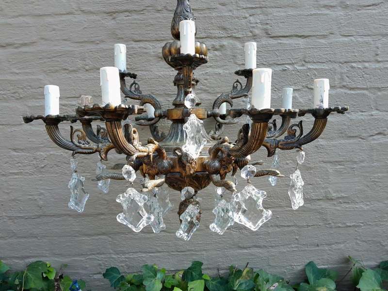 A 20th Century French Style Antique Brass and Crystal Twelve Light Chandelier