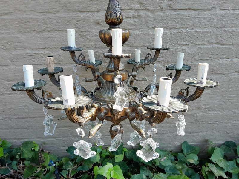 A 20th Century French Style Antique Brass and Crystal Twelve Light Chandelier