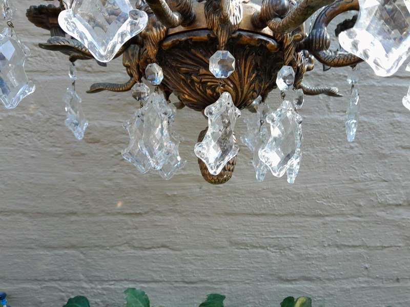A 20th Century French Style Antique Brass and Crystal Twelve Light Chandelier